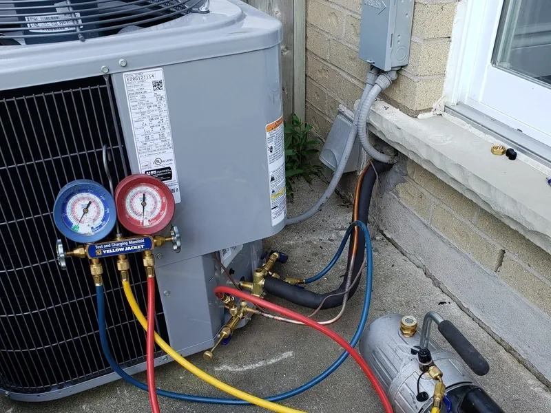Annual AC tune-up on an outdoor condenser in Cambridge