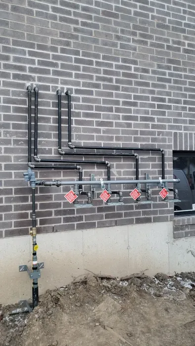 Row of commercial condensing units on a rooftop