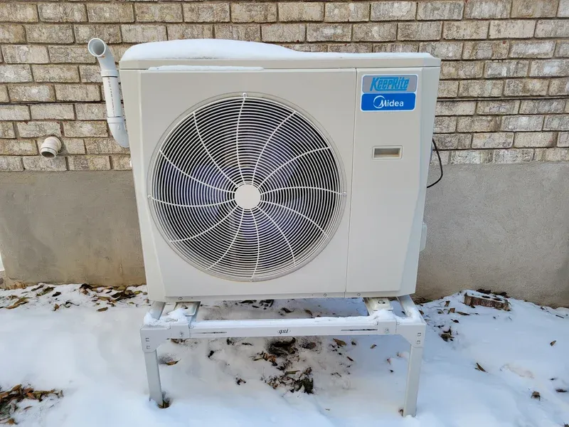 Heat pump outdoor unit installed beside a Kitchener home