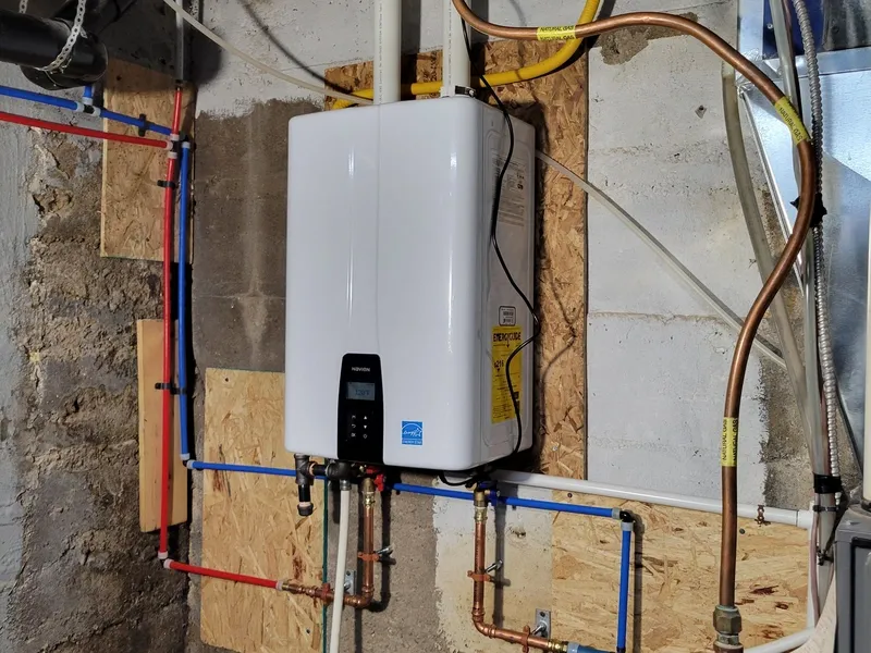 Technician diagnosing an on-demand water heater error code