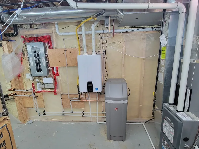 Tankless water heater mounted on a wall in a Cambridge home