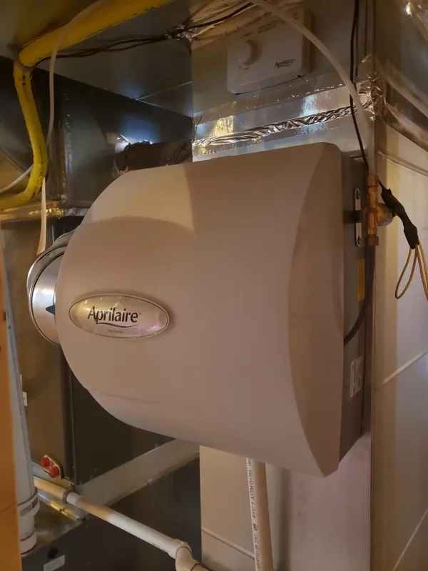 Bypass humidifier connected to a forced-air furnace duct