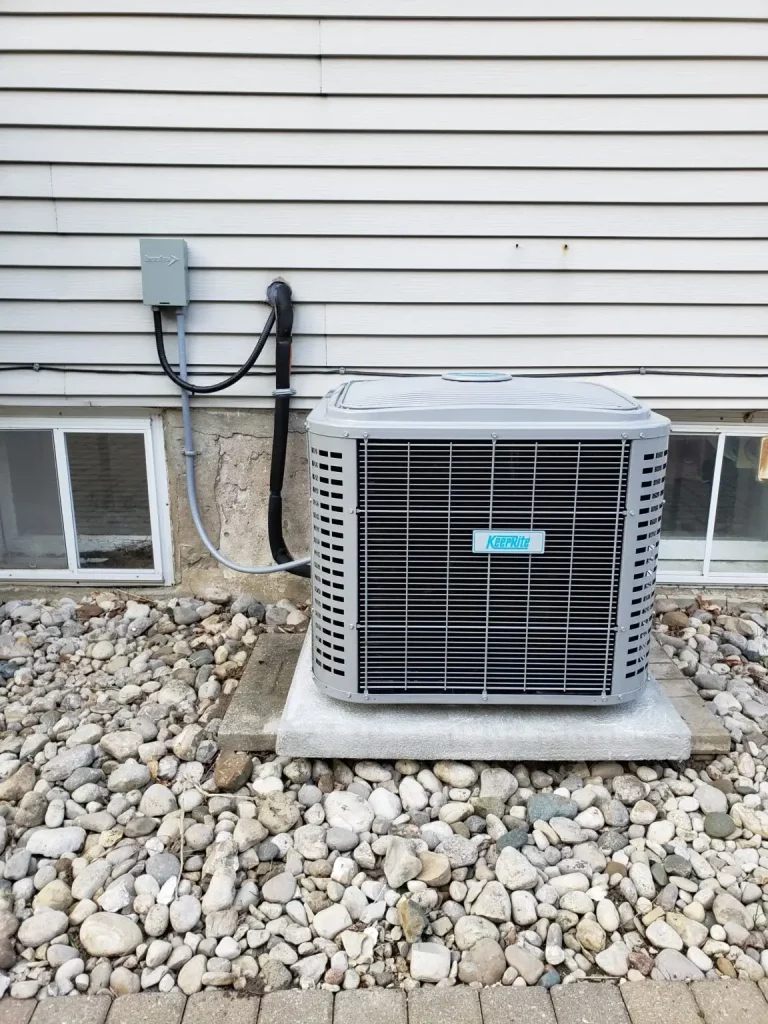 An air conditioning unit on a house after being repaired by an HVAC tech