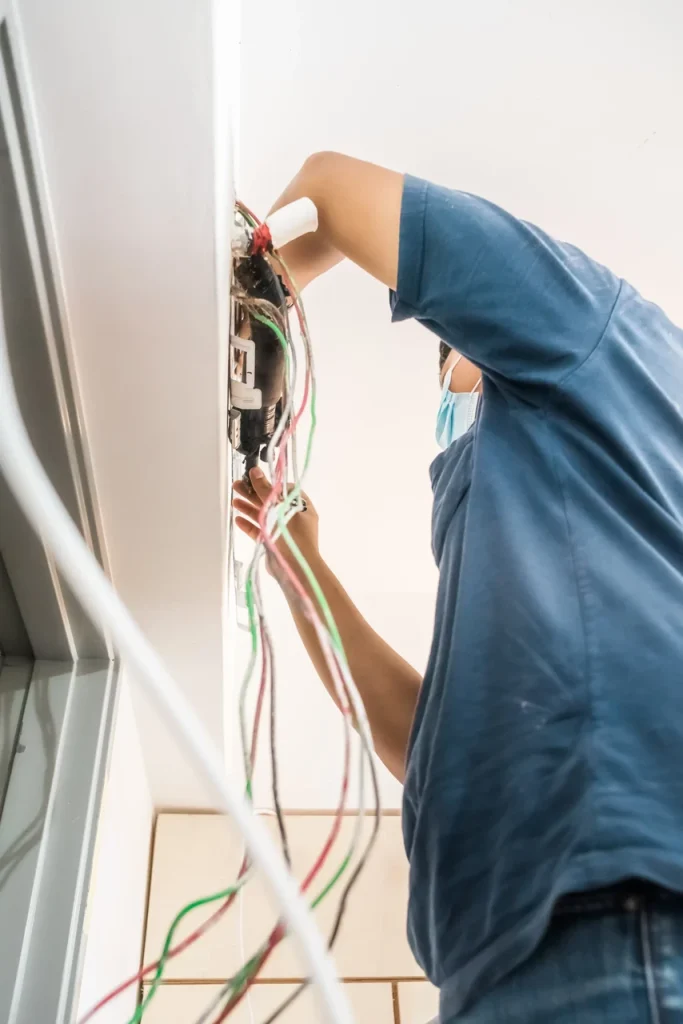 Air conditioning technician repairing an air conditioner in Waterloo